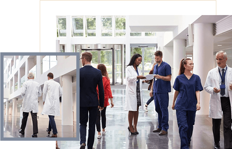 A group of people in medical uniforms walking down the hall.